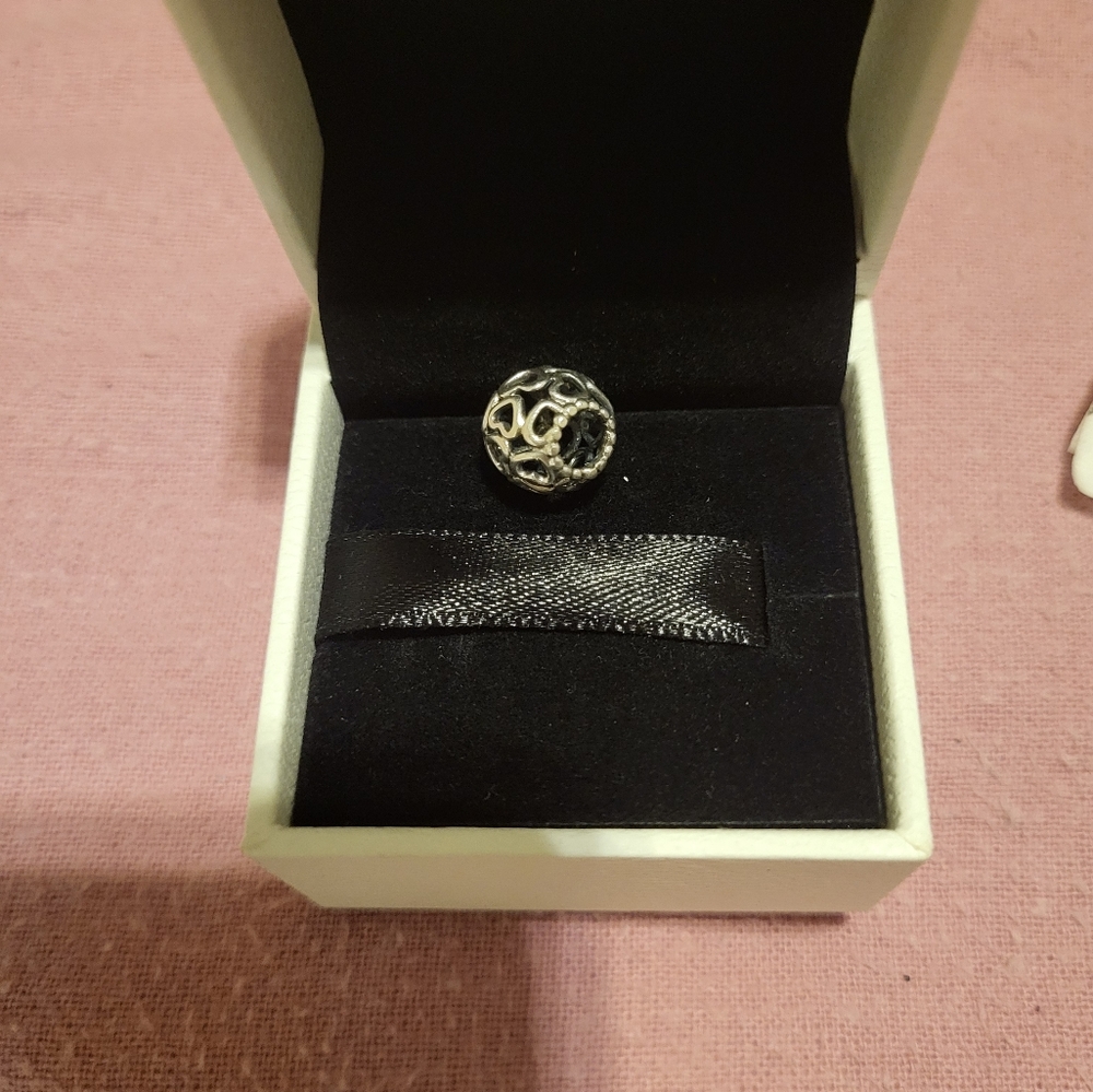 Pandora charms. EUC multiple hearts charm. Comes with box.